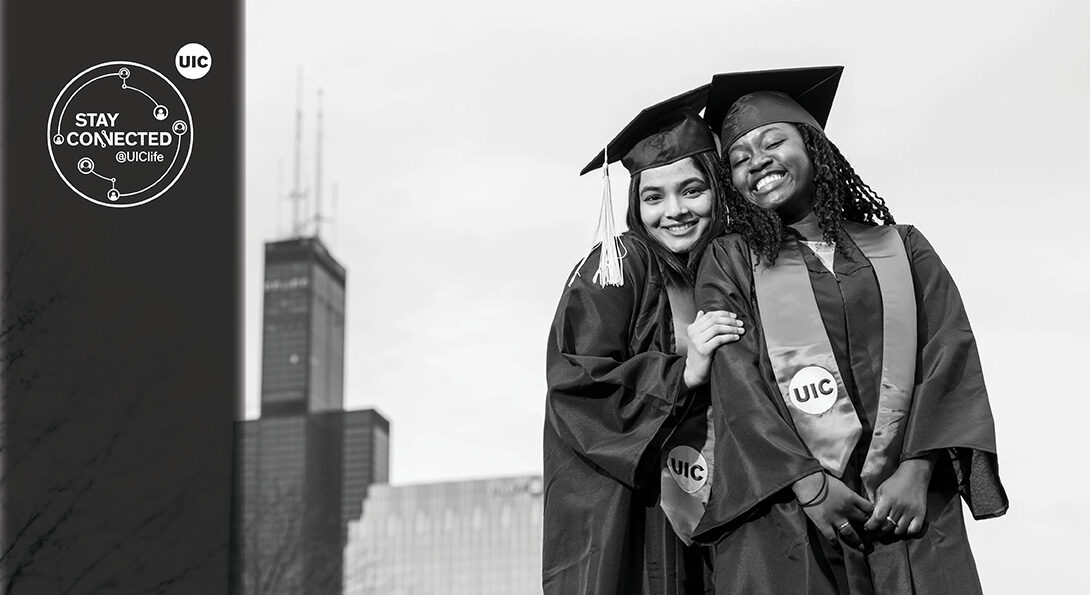 UIC Alumni in cap and gown with city background