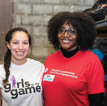 Two females smile for the camera at MLK Day of Service
                  
