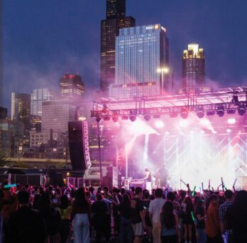 SPARK 2023 Concert with crowd and stage bathed in pink light
                  