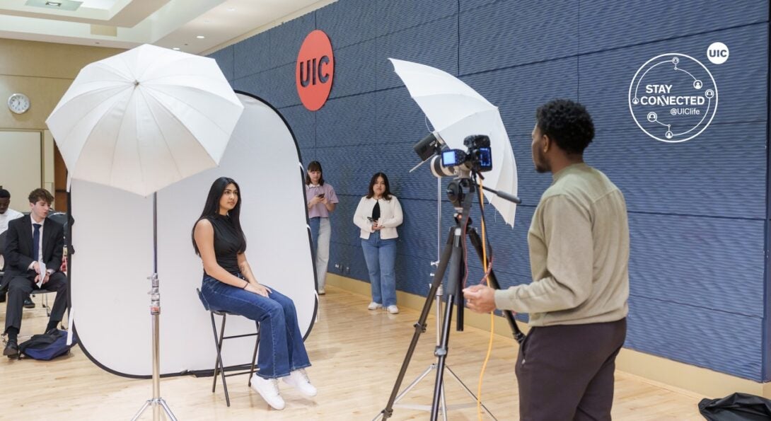 Student is getting a professional headshot taken at UIC Illinois Room